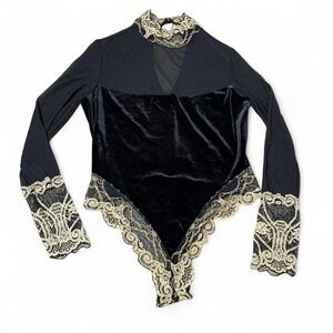 Black velvet bodysuit with gold lace trim and mesh chest